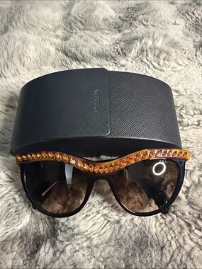 Prada Women's Dark Brown Sunglasses with Amber Crystal Brow